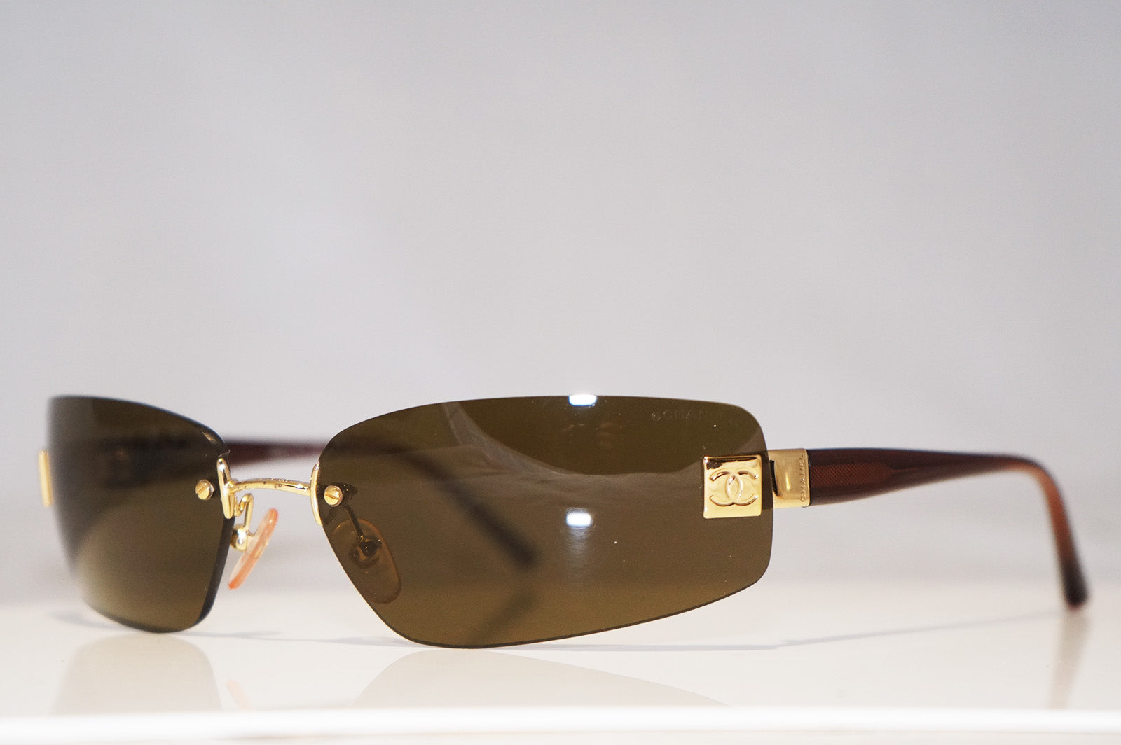CHANEL Mens Unisex Designer Sunglasses Brown Frameless 4018 C.139/73 1 –  SunglassBlog